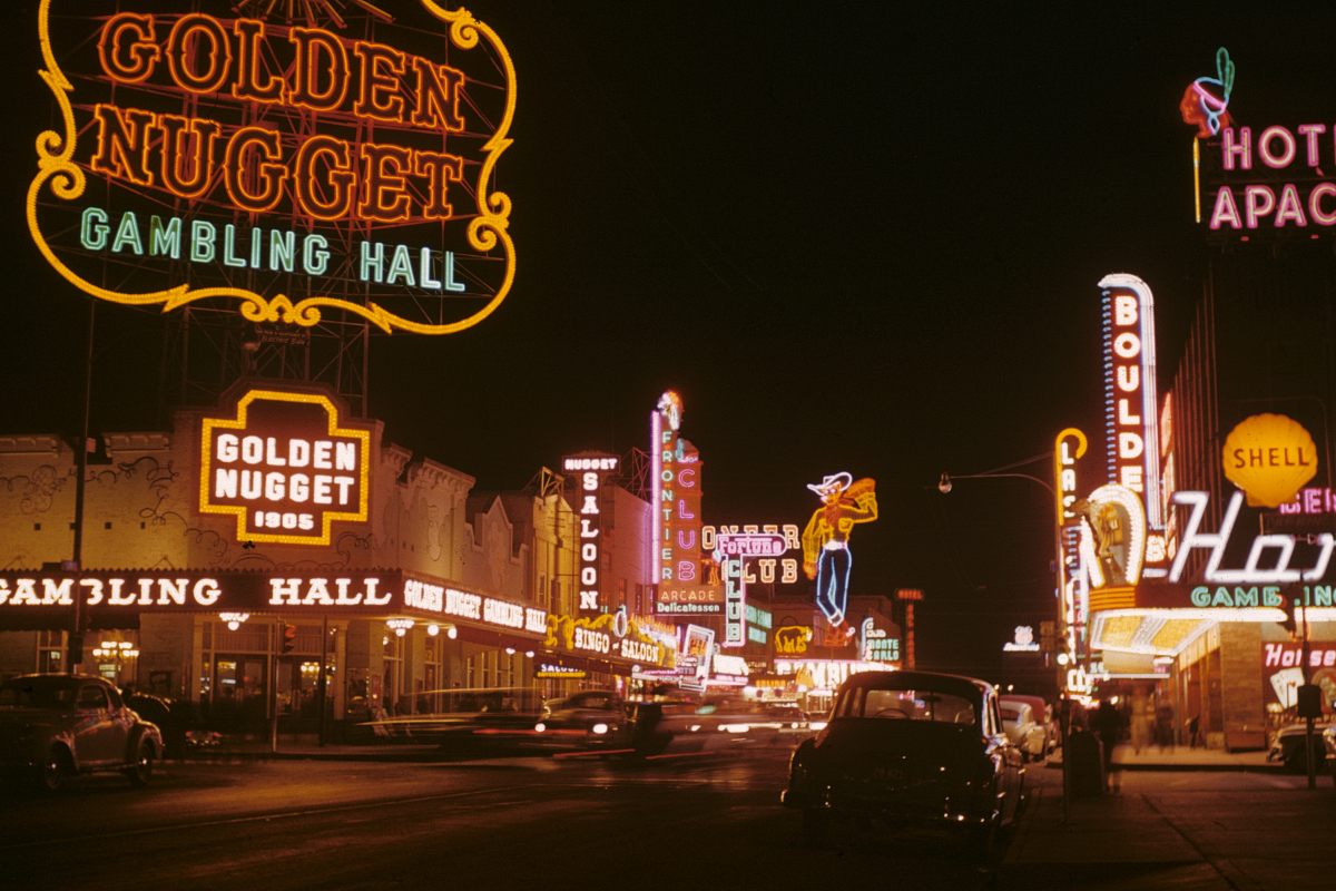 Fremont Street casino signs glowing at night in 1952